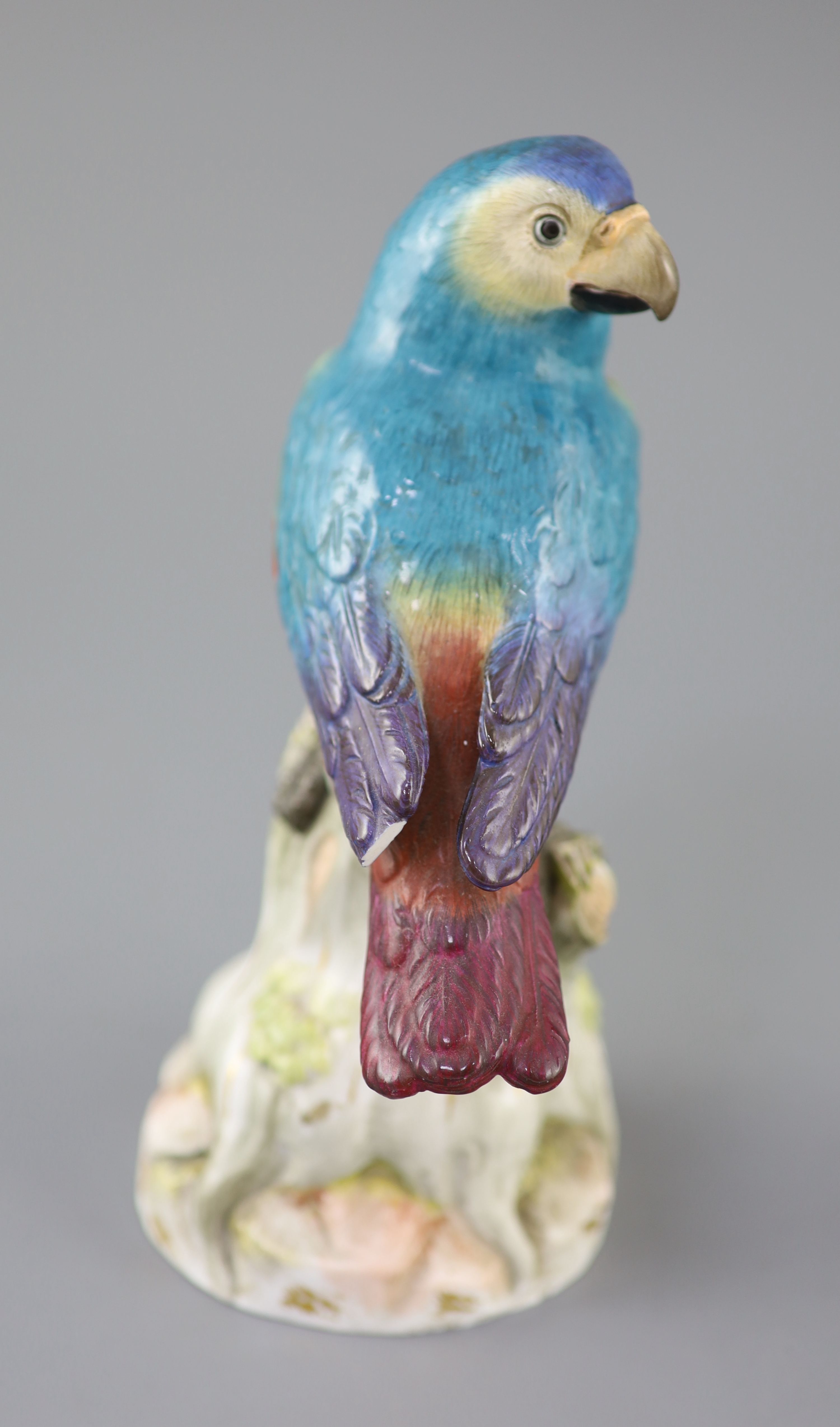 A Meissen model of a parrot seated on a tree stump, late 19th century, 22cm high